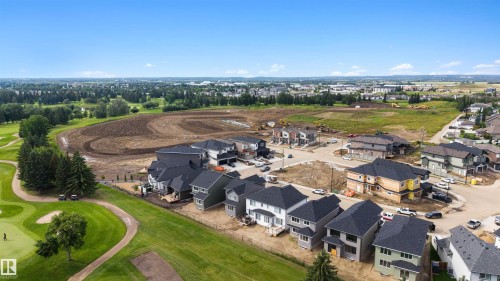 Expansive green spaces and mature trees surrounding a residential development - 16 Grayson Green, Stony Plain, AB - Outdoor With View