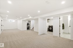 Spacious lower level featuring plush carpeting, recessed lighting, and a window for natural light - 
