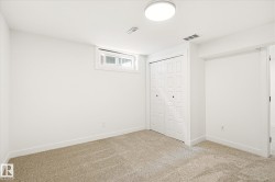 Bright room with carpet flooring, a window, bifold closet doors, and recessed lighting - 