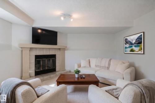435 Ormsby Road Nw, Edmonton, AB - Indoor Photo Showing Living Room With Fireplace