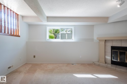435 Ormsby Road Nw, Edmonton, AB - Indoor Photo Showing Other Room With Fireplace