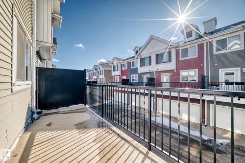 Outdoor balcony with black metal railing and privacy screen - #75 2803 James Mowatt Tr Sw, Edmonton, AB 