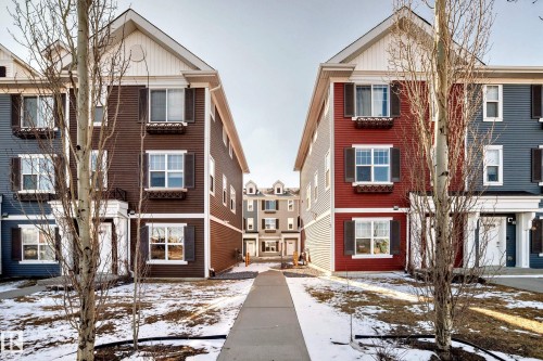 Multi-story townhome with contrasting siding and white trim - #75 2803 James Mowatt Tr Sw, Edmonton, AB 