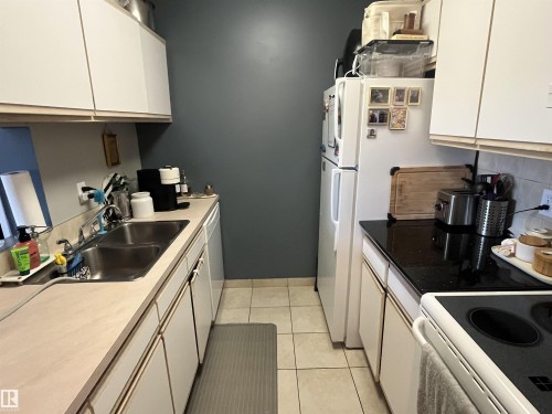 #205 5065 31 Av Nw, Edmonton, AB - Indoor Photo Showing Kitchen With Double Sink