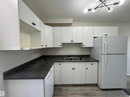 #A 17 Imperial Cr, Devon, AB - Indoor Photo Showing Kitchen With Double Sink