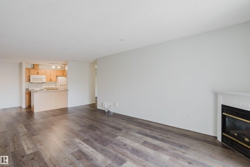 #324 2903 Rabbit Hill Rd Nw, Edmonton, AB - Indoor Photo Showing Living Room With Fireplace
