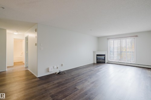 #324 2903 Rabbit Hill Rd Nw, Edmonton, AB - Indoor Photo Showing Living Room With Fireplace