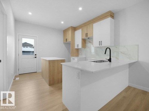 260 24 St Sw Sw, Edmonton, AB - Indoor Photo Showing Kitchen With Double Sink