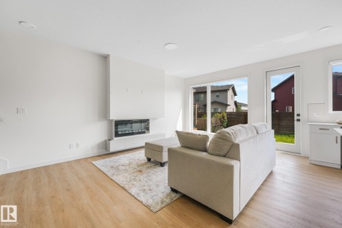 3217 Kulay Way Sw, Edmonton, AB - Indoor Photo Showing Living Room With Fireplace