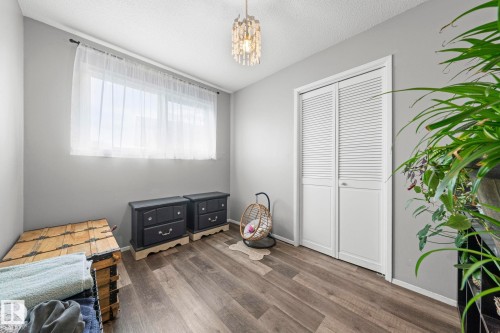 Wood-finish flooring with a neutral paint palette - 11119 31St Nw Nw, Edmonton, AB - Indoor Photo Showing Bedroom