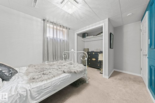 Recessed drop ceiling with integrated lighting - 11119 31St Nw Nw, Edmonton, AB - Indoor Photo Showing Bedroom