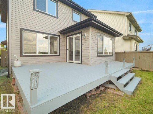 Expansive deck with steps and integrated post lighting - 3010 17A Ave Nw, Edmonton, AB - Outdoor With Exterior