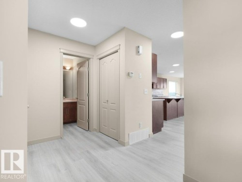 Wood-finish flooring throughout - 3010 17A Ave Nw, Edmonton, AB - Indoor Photo Showing Other Room