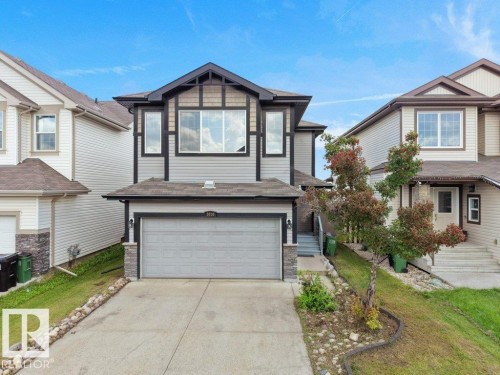 Contemporary exterior with mixed siding and stone accents - 3010 17A Ave Nw, Edmonton, AB - Outdoor With Facade