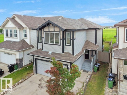 Two-story residence with a two-car garage and a paved driveway - 3010 17A Ave Nw, Edmonton, AB - Outdoor