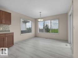 Light wood-finish flooring with a neutral wall color - 