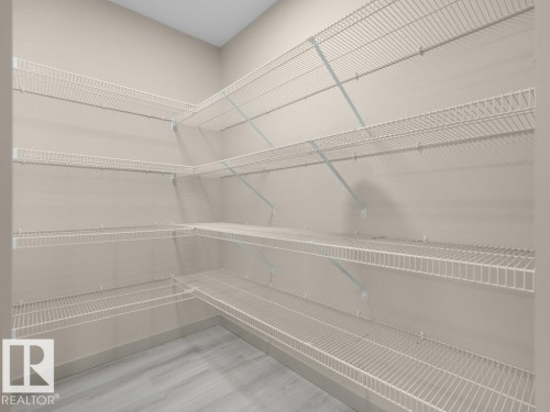 Corner storage system featuring multiple wire shelves - 3010 17A Ave Nw, Edmonton, AB - Indoor With Storage