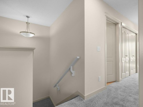 Recessed lighting fixture, light-toned wall paint, white trim, carpeted flooring, paneled doors - 3010 17A Ave Nw, Edmonton, AB - Indoor Photo Showing Other Room