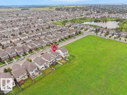 Residential neighborhood with a large adjacent green space and nearby pond - 3010 17A Ave Nw, Edmonton, AB -  With View