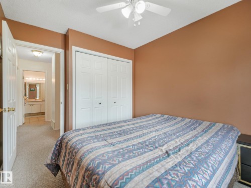 Neutral-toned carpeting paired with a ceiling fan - 18417 66 Avenue Nw, Edmonton, AB - Indoor Photo Showing Bedroom