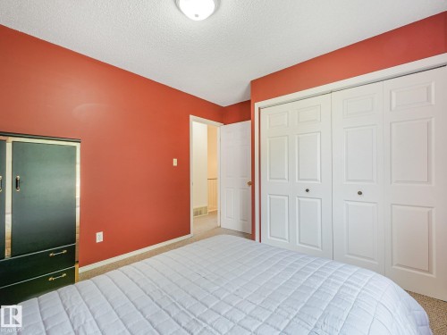 Recessed ceiling light fixture and textured ceiling - 18417 66 Avenue Nw, Edmonton, AB - Indoor Photo Showing Bedroom
