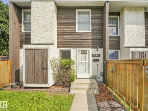 Exterior featuring wood siding and stucco finishes - 18417 66 Avenue Nw, Edmonton, AB - Outdoor