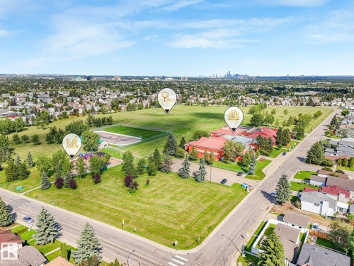 Expansive green spaces and mature trees surrounding a residential neighborhood - 18417 66 Avenue Nw, Edmonton, AB - Outdoor With View