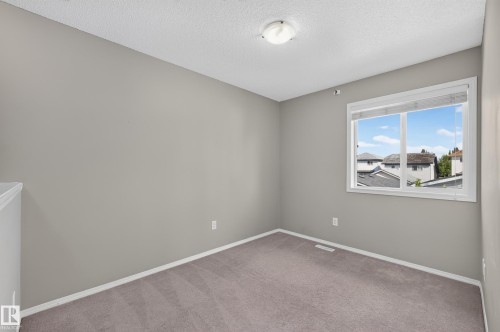Neutral-toned walls with contrasting white trim - 6008 South Terwillegar Boulevard Nw, Edmonton, AB - Indoor Photo Showing Other Room