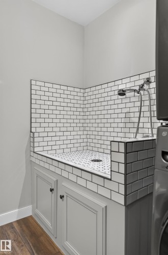 Built-in wash station featuring subway tile surround, mosaic tile floor, and a polished chrome shower fixture - 6008 South Terwillegar Boulevard Nw, Edmonton, AB - Indoor Photo Showing Other Room