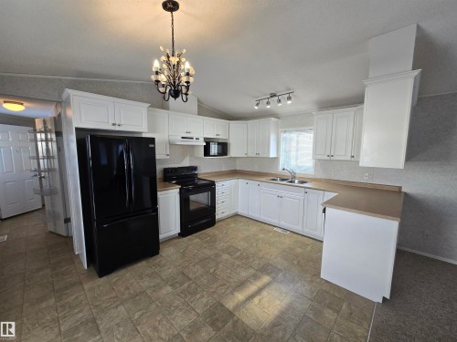 1133 Aspen Drive, Leduc, AB - Indoor Photo Showing Kitchen With Double Sink