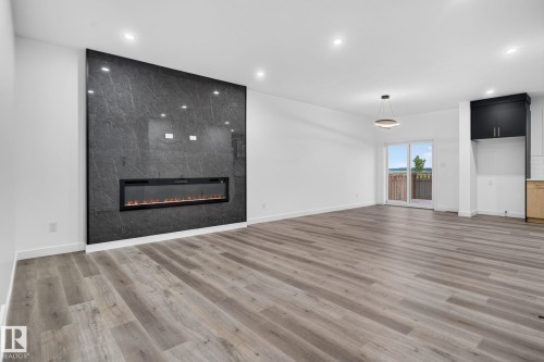 13 Enns Crest, Fort Saskatchewan, AB - Indoor Photo Showing Living Room With Fireplace