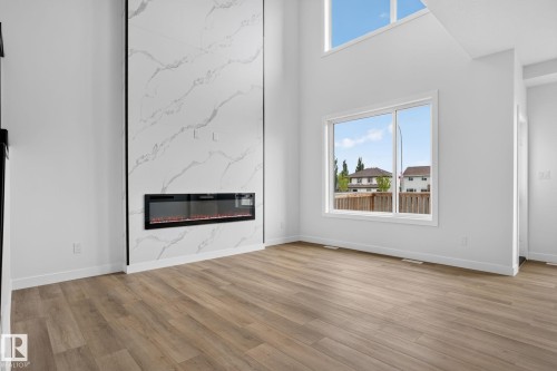 49 Elliott Wynd, Fort Saskatchewan, AB - Indoor Photo Showing Living Room With Fireplace