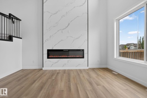 49 Elliott Wynd, Fort Saskatchewan, AB - Indoor Photo Showing Living Room With Fireplace