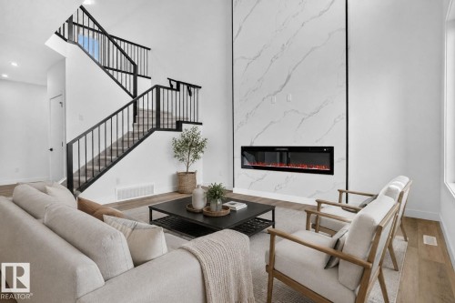 49 Elliott Wynd, Fort Saskatchewan, AB - Indoor Photo Showing Living Room With Fireplace