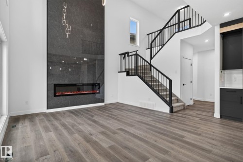 45 Elliott Wynd, Fort Saskatchewan, AB - Indoor Photo Showing Other Room With Fireplace