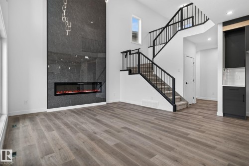 45 Elliott Wynd, Fort Saskatchewan, AB - Indoor Photo Showing Other Room With Fireplace