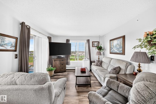 Wood-finish flooring throughout - #401 5390 Chappelle Rd Sw, Edmonton, AB 