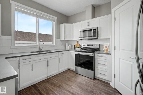118 Southfork Road, Leduc, AB - Indoor Photo Showing Kitchen With Double Sink
