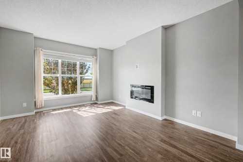 118 Southfork Road, Leduc, AB - Indoor Photo Showing Living Room With Fireplace