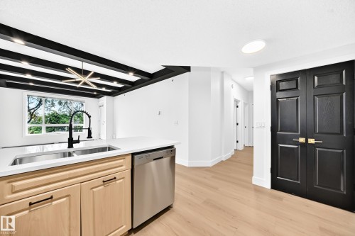 #323 6315 135 Av Nw, Edmonton, AB - Indoor Photo Showing Kitchen With Double Sink
