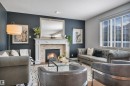 4231 Savaryn Drive Sw, Edmonton, AB  - Indoor Photo Showing Living Room With Fireplace 