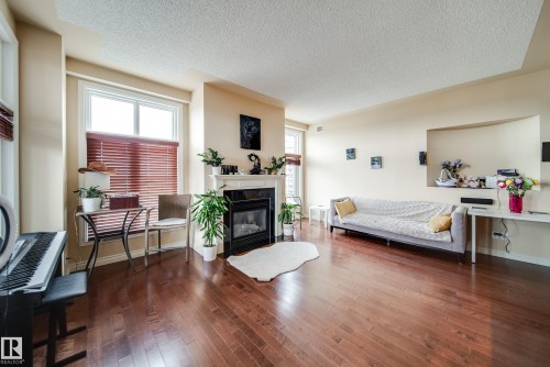 #1301 9020 Jasper Av Nw, Edmonton, AB - Indoor Photo Showing Living Room With Fireplace