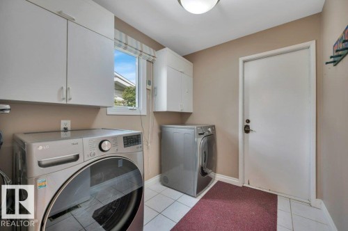 Which leads to the double attached garage - 5620 151 Street Nw, Edmonton, AB - Indoor Photo Showing Laundry Room