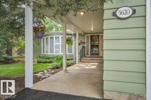 Covered entryway with concrete pathway and bay window - 5620 151 Street Nw, Edmonton, AB - Outdoor