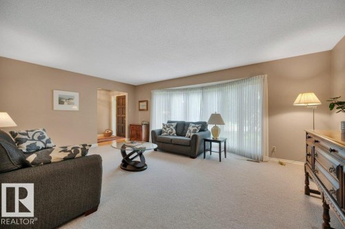With a large bay window - 5620 151 Street Nw, Edmonton, AB - Indoor Photo Showing Living Room