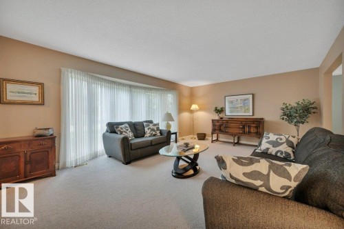 Spacious living with a large bay window. - 5620 151 Street Nw, Edmonton, AB - Indoor Photo Showing Living Room