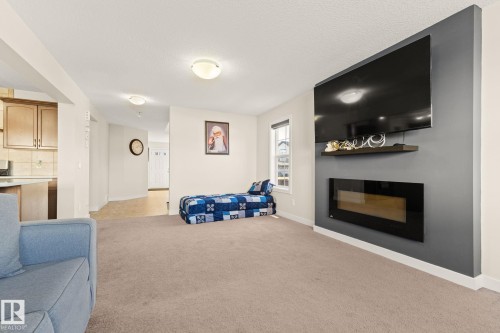 724 40 Avenue Nw, Edmonton, AB - Indoor Photo Showing Living Room With Fireplace