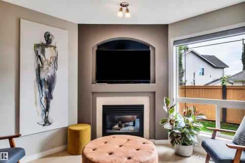 #12 20 Norman Ct, St. Albert, AB - Indoor Photo Showing Living Room With Fireplace