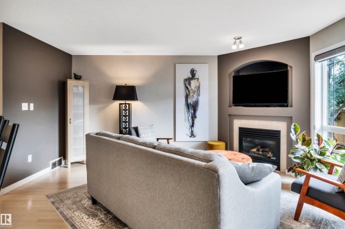 #12 20 Norman Ct, St. Albert, AB - Indoor Photo Showing Living Room With Fireplace