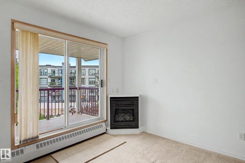 #452 10520 120 Nw, Edmonton, AB - Indoor With Fireplace